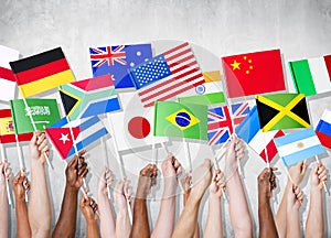 Group Of Hands Holding National Flags