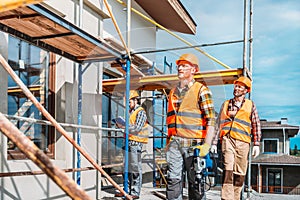 group of handsome builders working together