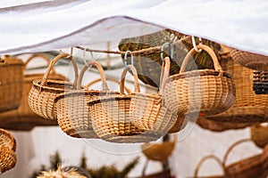 Group of hanging empty wicker baskets