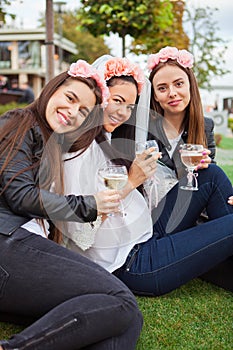 Group happines women with champagne at hen party