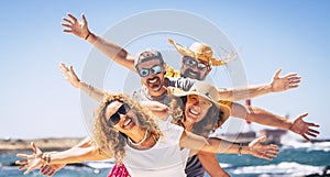 Group of happy adult friends enjoy and celebrate together the summer holiday vacation travel leisure acitivity - men and women