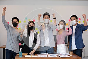 Group of Happy Asian business men leader standing smile celebrating confidence with Business team at Co-Working space