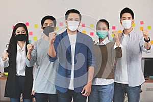 Group of Happy Asian business men leader standing smile celebrating fight confidence with Business team at Co-Working space,Small