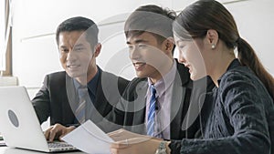 Group of happy asian business people working on computer with staff partner business  in meeting conference room