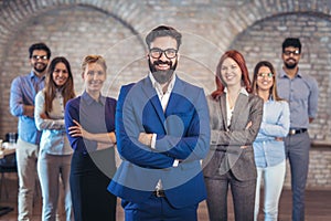 Group of happy business people and company staff in modern office