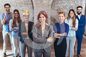 Group of happy business people and company staff in modern office