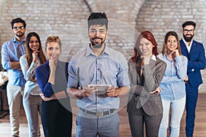 Group of happy business people and company staff in modern office