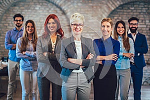 Group of happy business people and company staff in modern office