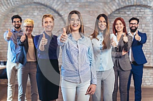 Group of happy business people and company staff in modern office