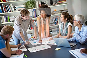 Group of happy business people discussing and working together during a meeting in office