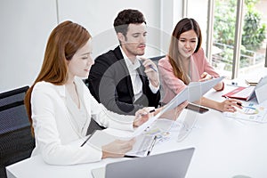 Group of happy business people men and woman working together with paper document file in meeting room.teamwork of two girl asian