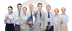 Group of happy business people pointing at you