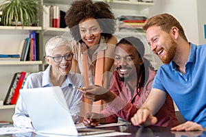 Group of happy business people working as a team at the office on meeting.