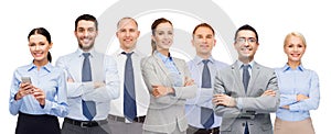 Group of happy businesspeople with crossed arms