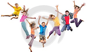 Group of happy cheerful sportive children jumping and dancing