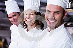 Group of happy chefs smiling at the camera