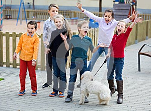 Group of happy children in high spirits jumping