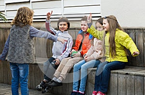 Group of happy children playing charades