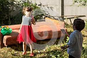 Group of happy children playing outdoors. Kids having fun in the garden.