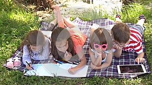 Group of happy children playing outdoors in summer park. Slow motion