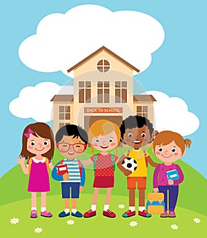 Group of happy children standing in front of the school building