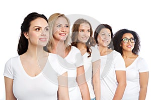 Group of happy different women in white t-shirts