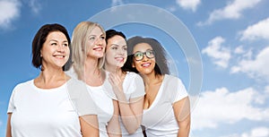 Group of happy different women in white t-shirts