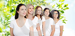 Group of happy different women in white t-shirts