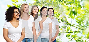 Group of happy different women in white t-shirts