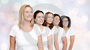 Group of happy different women in white t-shirts