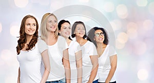 Group of happy different women in white t-shirts