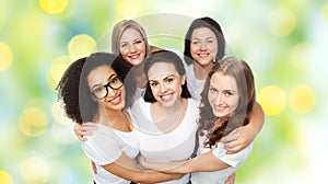 Group of happy different women in white t-shirts