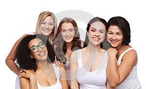 Group of happy different women in white underwear