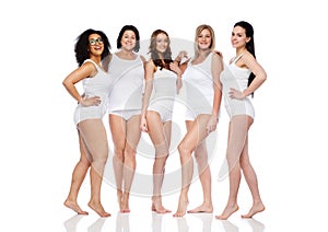 Group of happy different women in white underwear