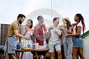 Group of happy diverse friends having fun at barbecue party outdoor in backyard