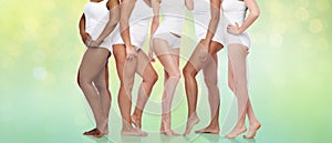 Group of happy diverse women in white underwear