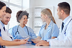 Group of happy doctors meeting at hospital office