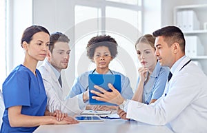 Group of happy doctors meeting at hospital office