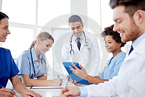 Group of happy doctors meeting at hospital office