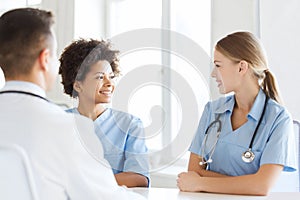 Group of happy doctors meeting at hospital office