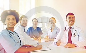 Group of happy doctors meeting at hospital office