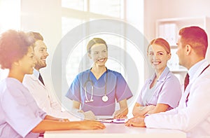 Group of happy doctors meeting at hospital office