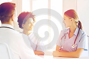 Group of happy doctors meeting at hospital office