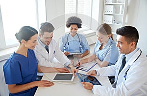 Group of happy doctors meeting at hospital office