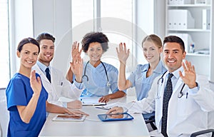 Group of happy doctors meeting at hospital office