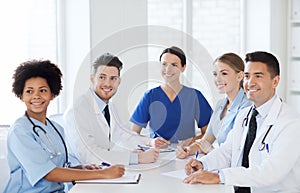 Group of happy doctors meeting at hospital office