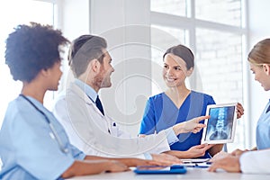 Group of happy doctors meeting at hospital office