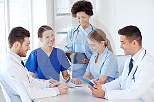 Group of happy doctors meeting at hospital office