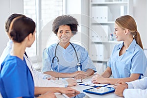 Group of happy doctors meeting at hospital office