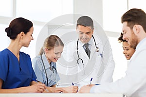 Group of happy doctors meeting at hospital office